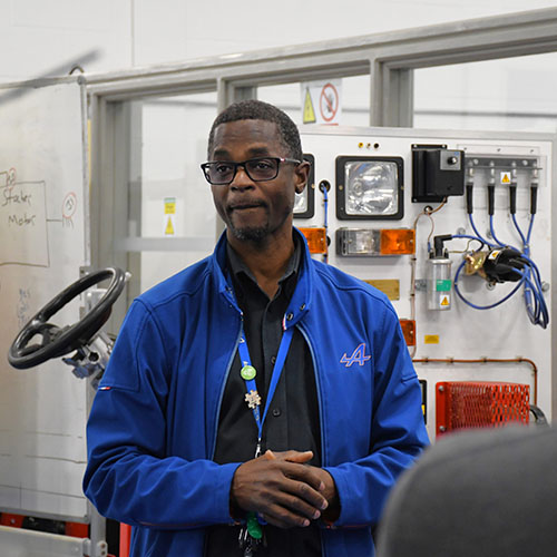 Motor Vehicle Tutor Giving Tour of Facilities