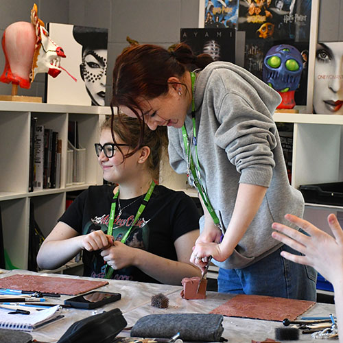 Student Cutting Sculpting Clay