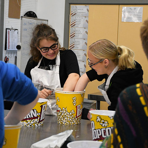 Two Students Mixing Casting Plaster